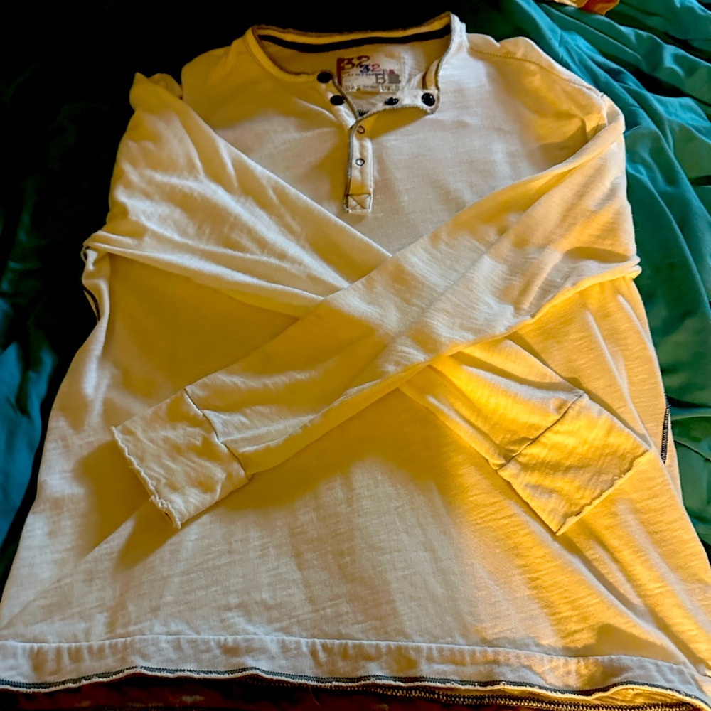32 Bar Blues Henley white with a blue stitching throughout.